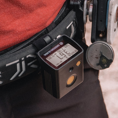 Shooters Global SG Timer GO on shooting range bench demonstrating real-use benefit