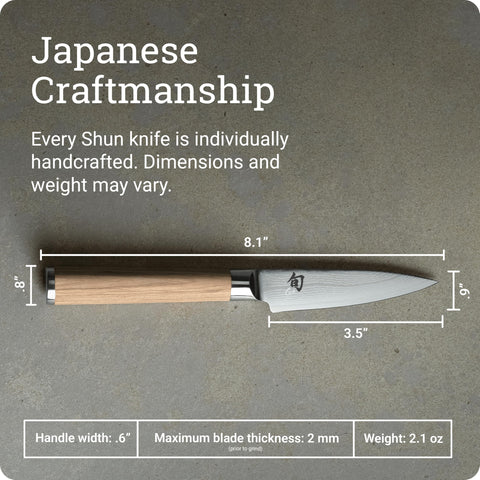 Shun Classic Blonde next to fingers showing 3.5-inch blade scale and accuracy