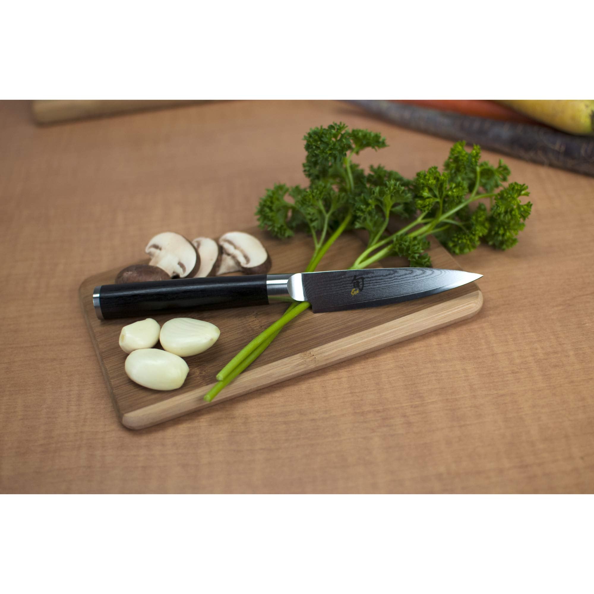 Shun classic paring knife blade closeup highlighting VG‑MAX core and sharp edge for clean cuts