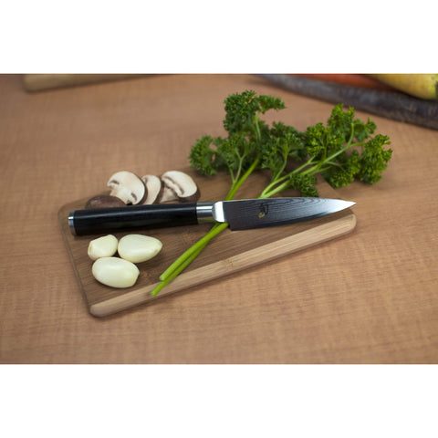 Shun classic paring knife blade closeup highlighting VG‑MAX core and sharp edge for clean cuts