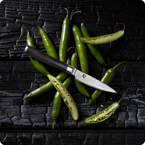 Shun classic paring knife packaging and warranty card conveying handcrafted origin and lifetime support