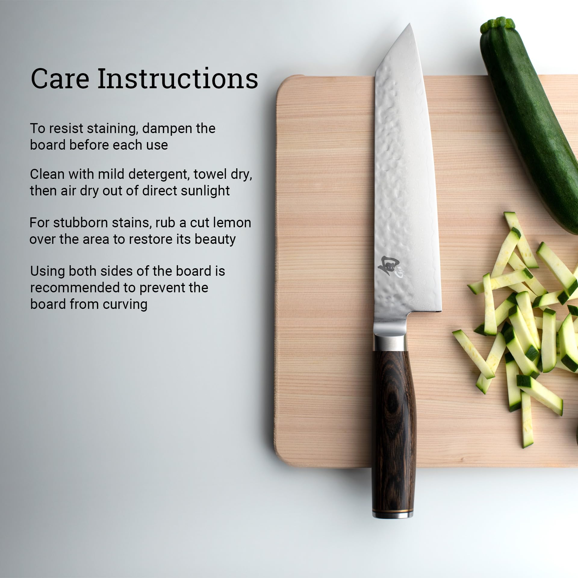 Shun hinoki on countertop with knives and ingredients portraying everyday kitchen practicality