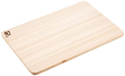 Shun hinoki side view comparing thickness to hand for clear size and handling benefit