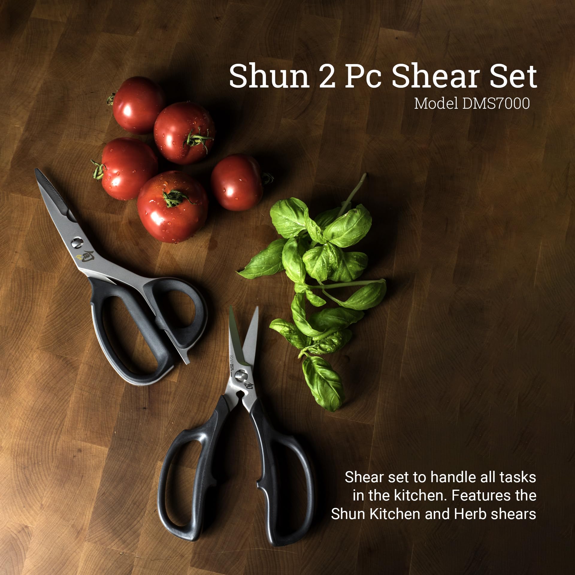 Shun kitchen shear close-up showing 420J2 steel notch and sharp edge for tough cutting