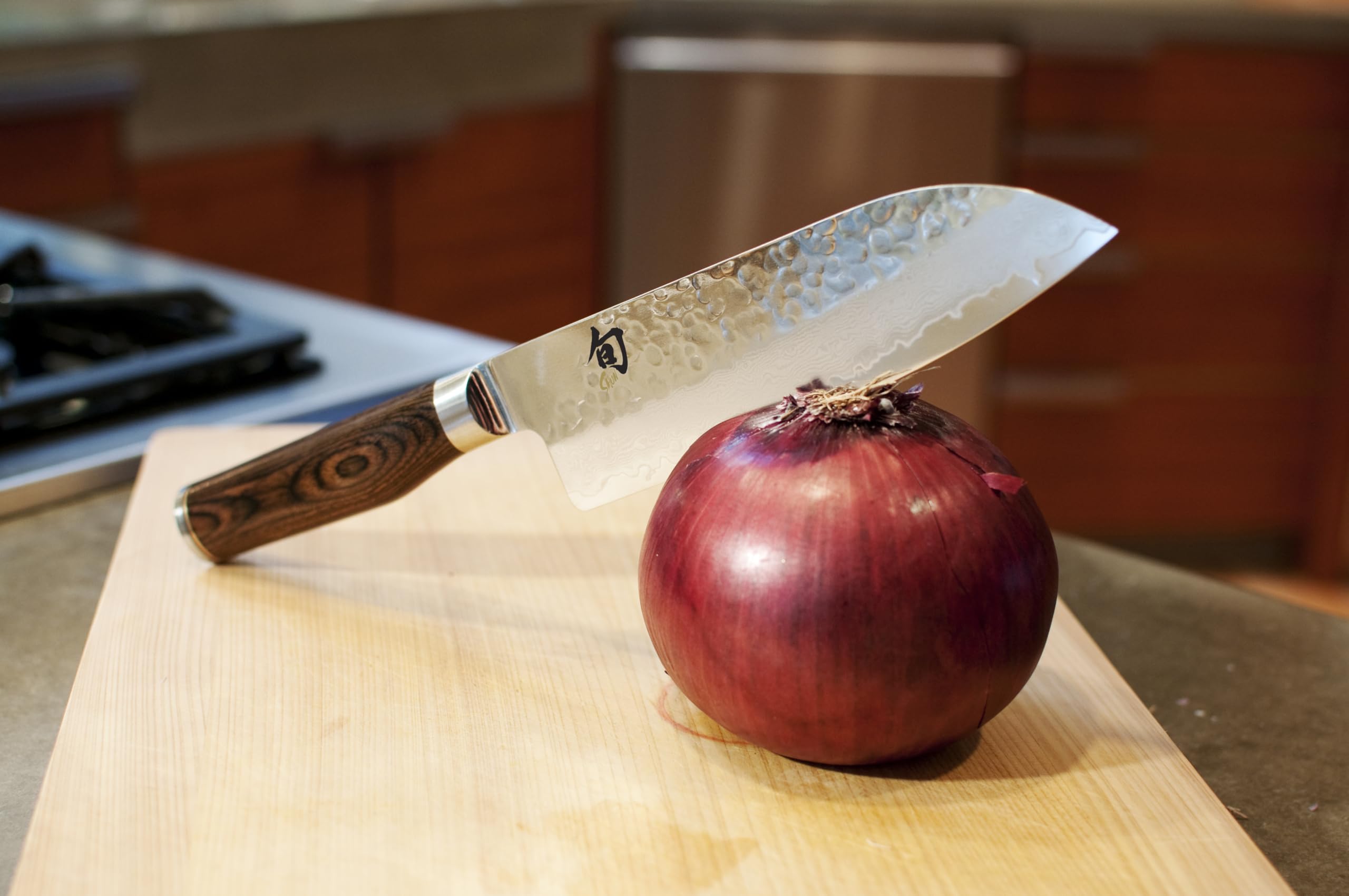 Shun Premier tsuchime hammered finish close-up reduces food sticking and drag
