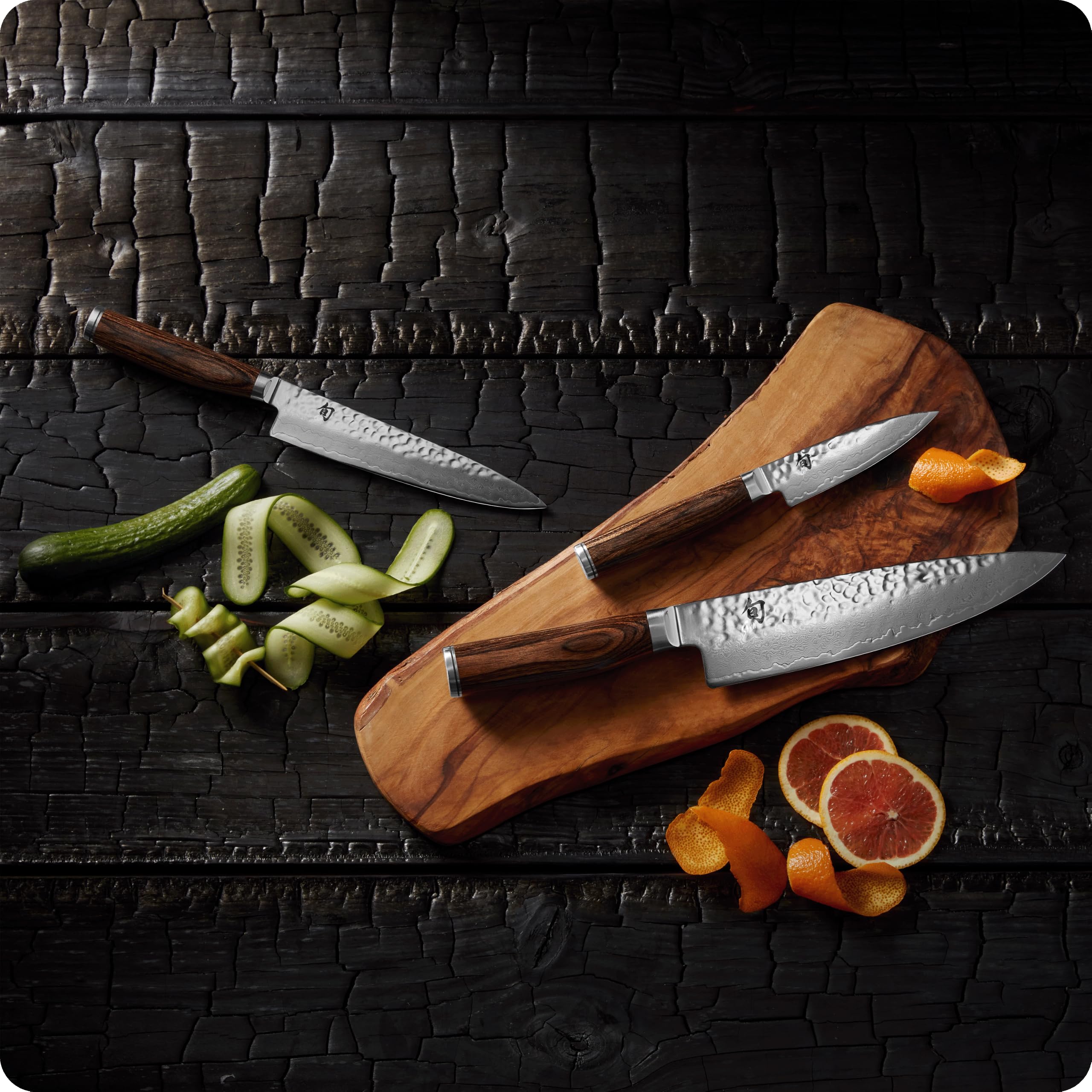 Shun premier scale comparison on cutting board illustrating compact versatility