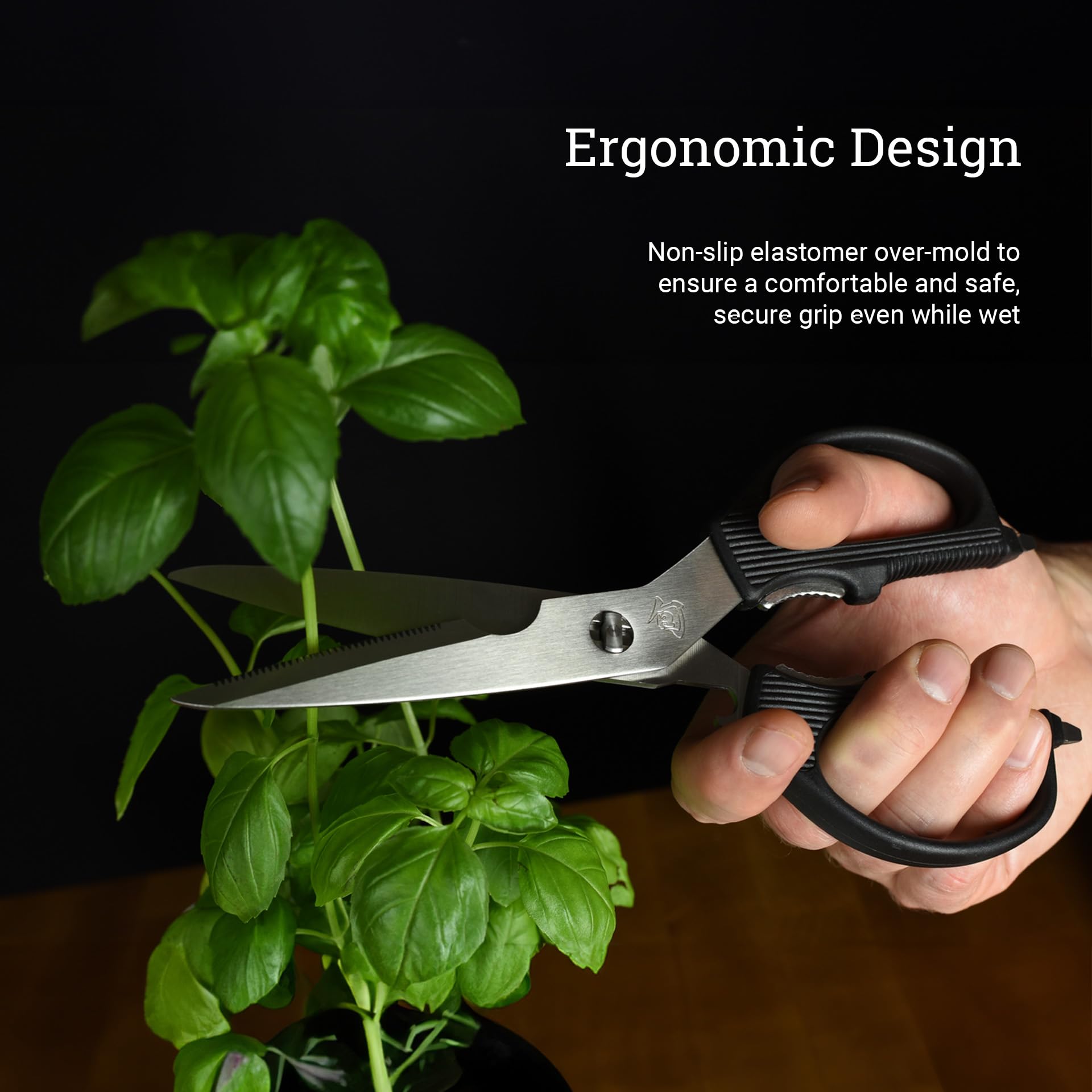 Shun shears cutting fresh herbs demonstrating precise, effortless snipping