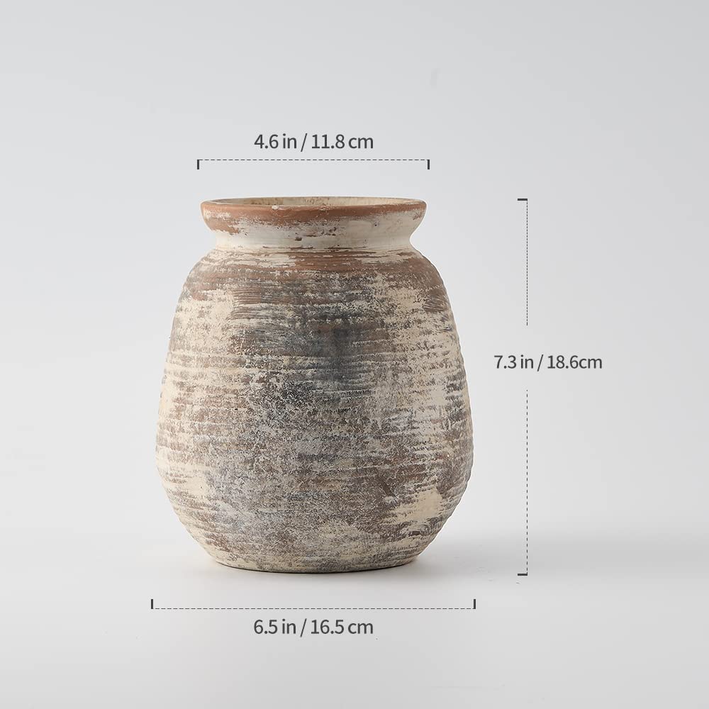 SIDUCAL vase beside book for size comparison demonstrating compact scale and tabletop fit