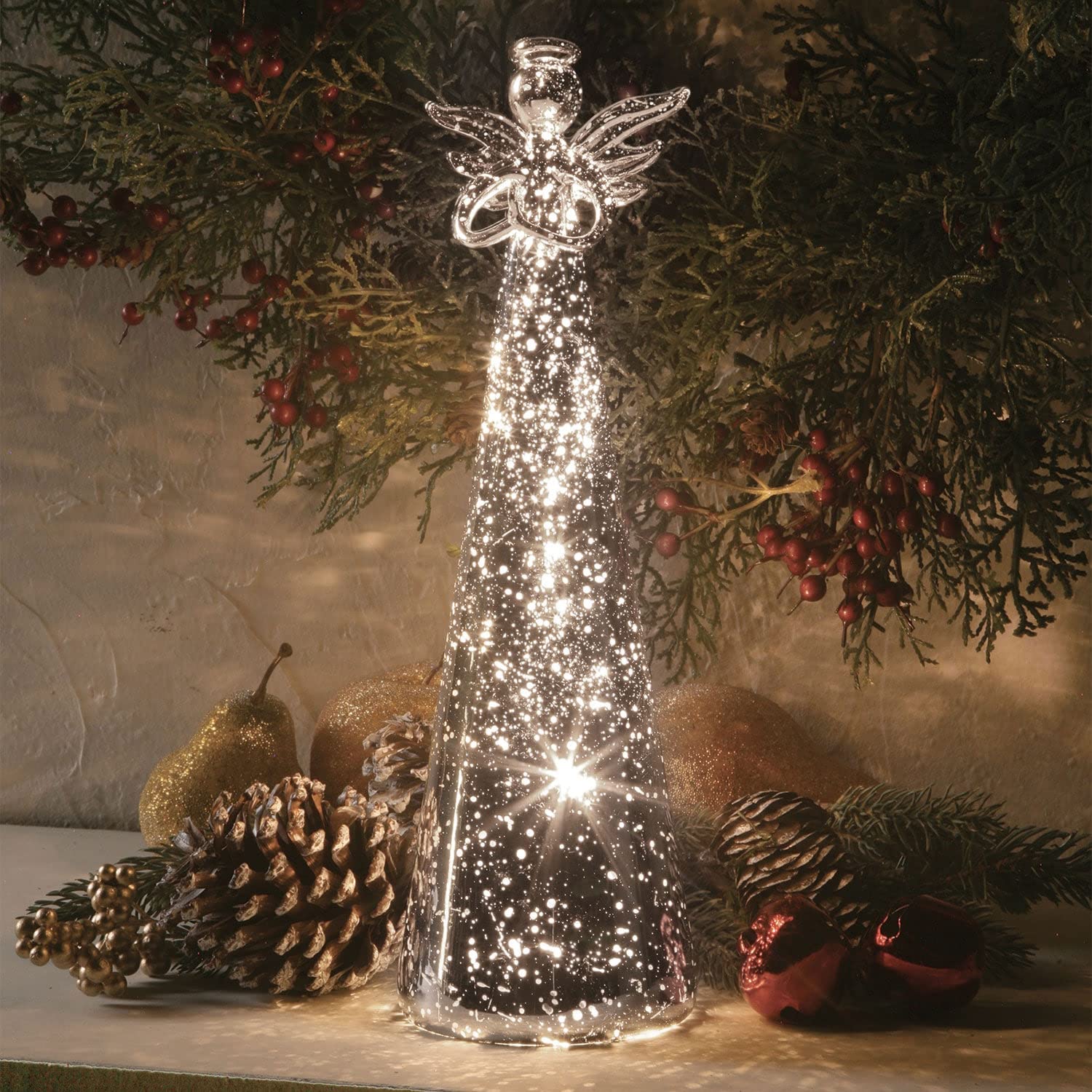 SIGNALS lighted angel glowing on mantel creating warm ambient light in room