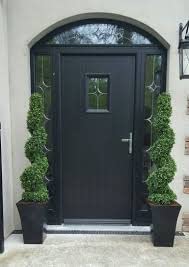 Silk Tree Warehouse pair of spiral topiaries placed in heavy planters demonstrating outdoor-ready styling
