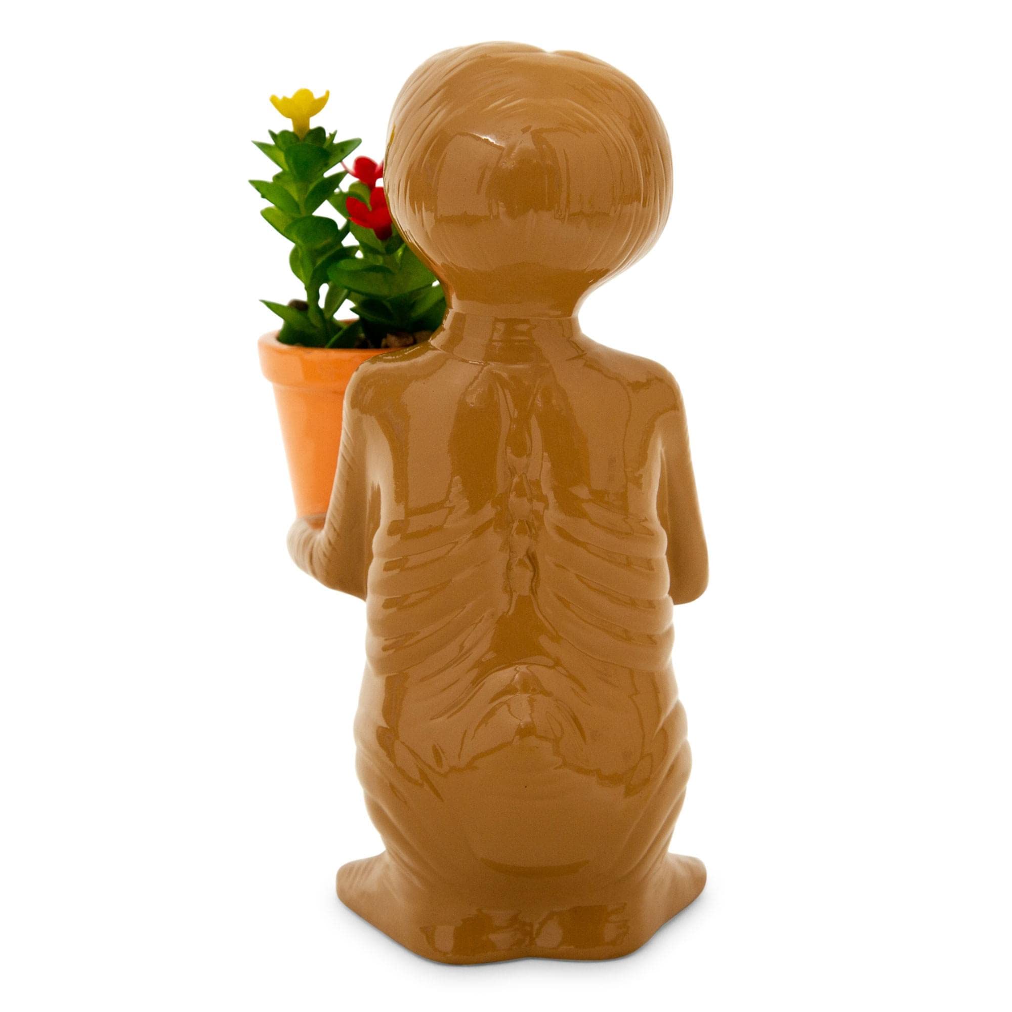 Silver Buffalo E.T. held in hand to show 7-inch scale and easy placement on small surfaces