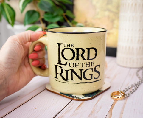 Silver Buffalo mug on a desk near books showing fandom display and practical drink use