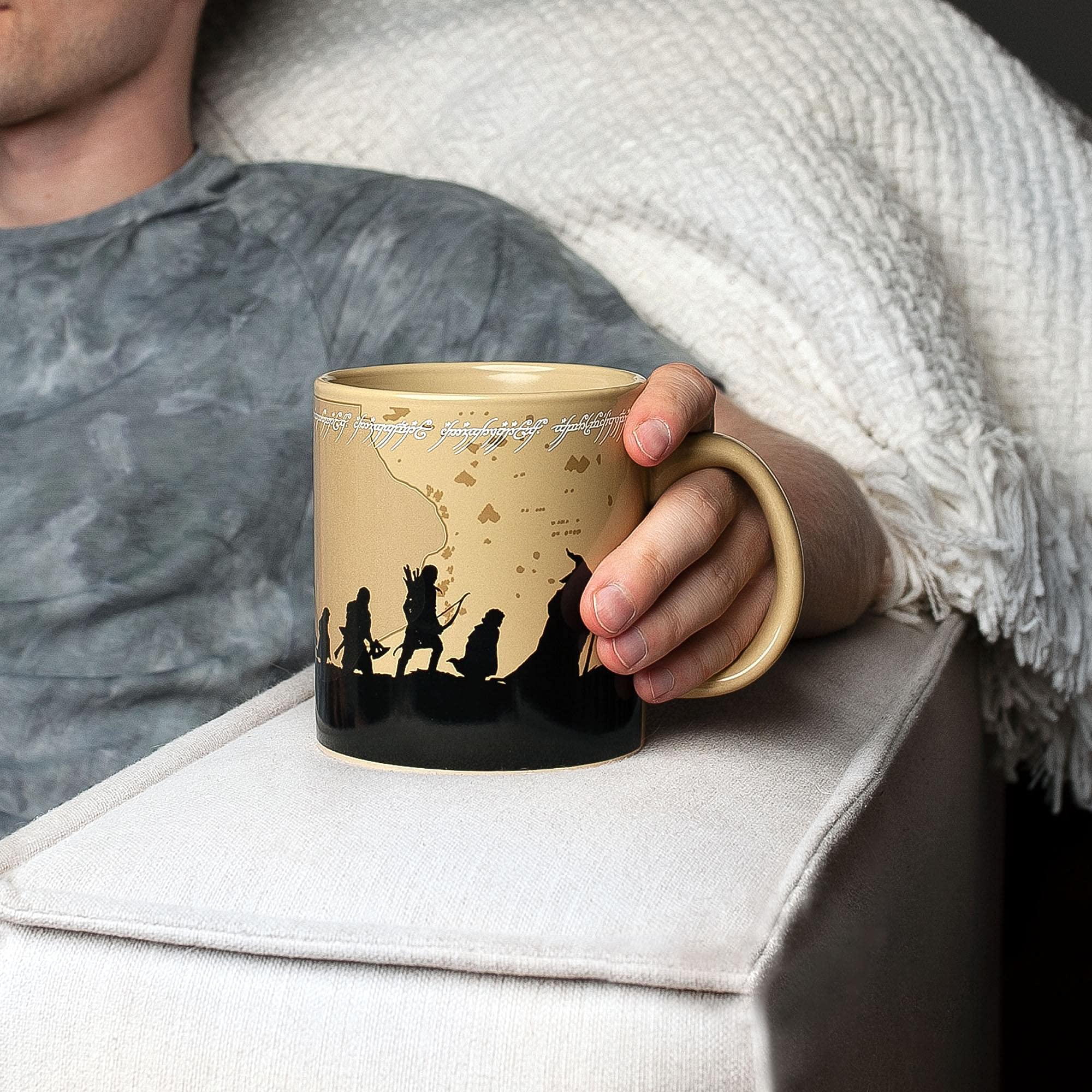 Silver Buffalo mug held in hand showing everyday use and comfortable handling benefit
