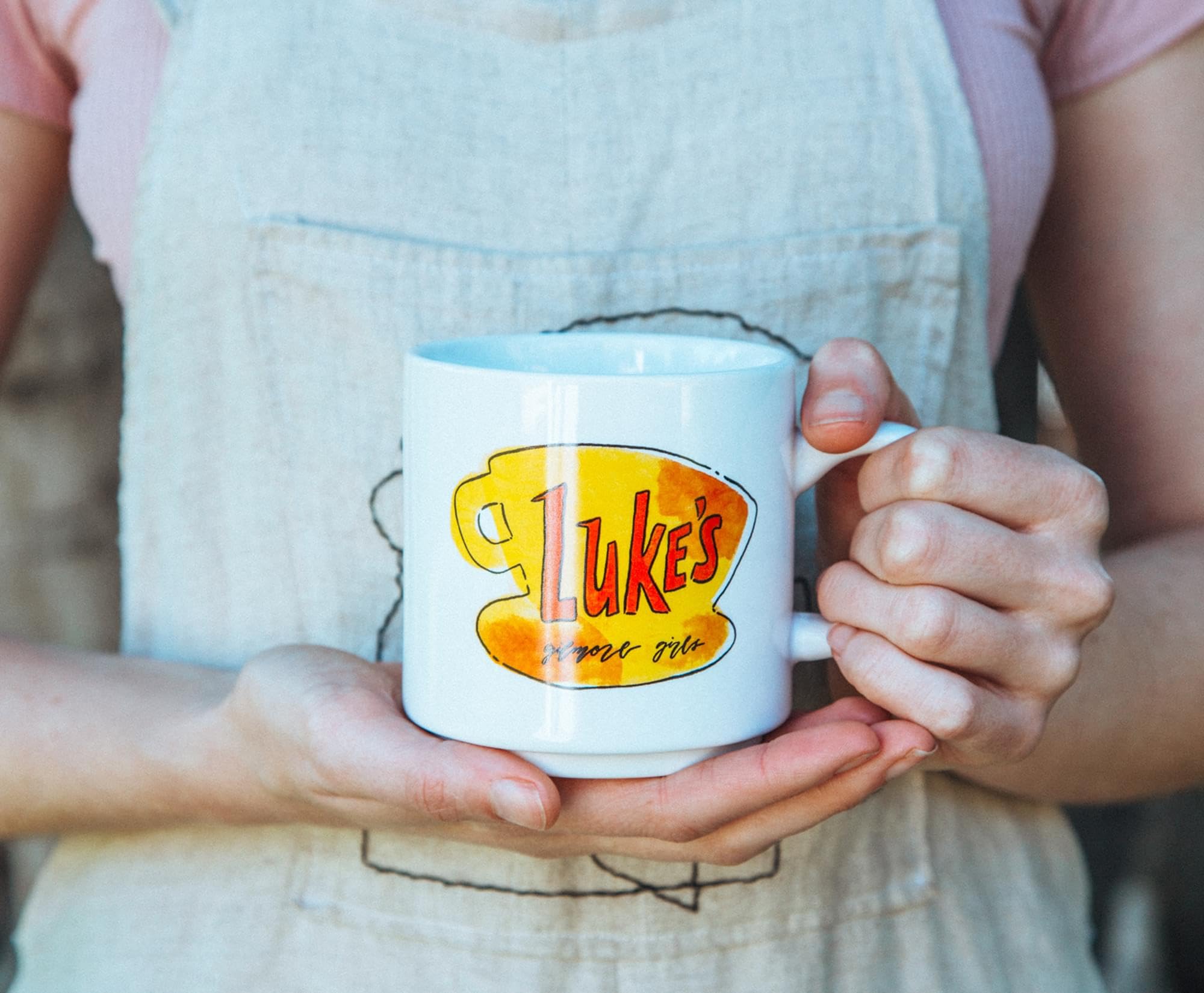 Silver Buffalo mug held in hand to show size and comfortable grip