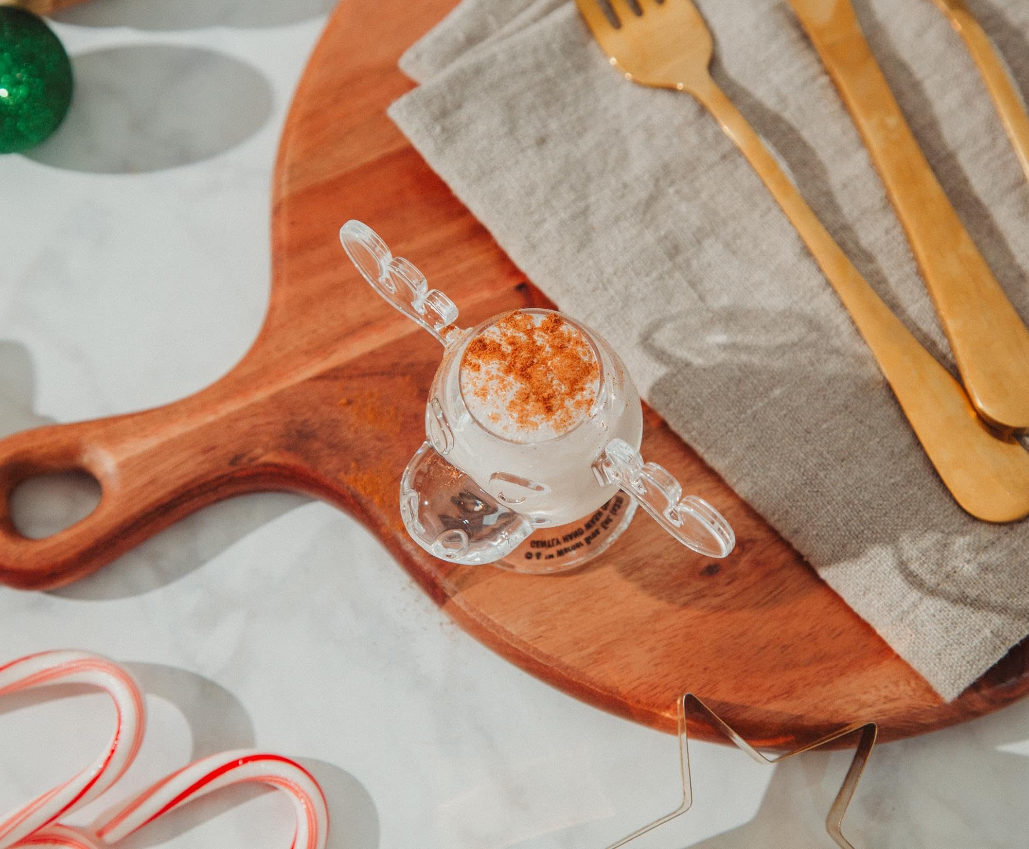 Silver Buffalo Marty Moose on a holiday bar with eggnog, adding festive movie-themed fun