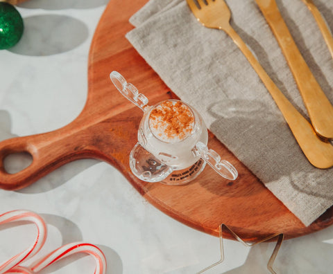 Silver Buffalo Marty Moose on a holiday bar with eggnog, adding festive movie-themed fun