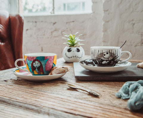 Silver Buffalo cup next to a teaspoon for scale, shows compact 6.7 oz capacity benefit