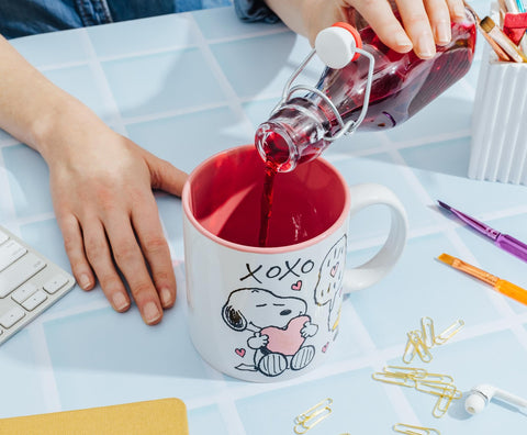 Silver Buffalo mug beside soda can, illustrates size and generous volume