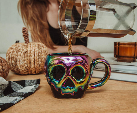 Silver Buffalo mug held in hand to show 20-ounce scale and practical serving benefit
