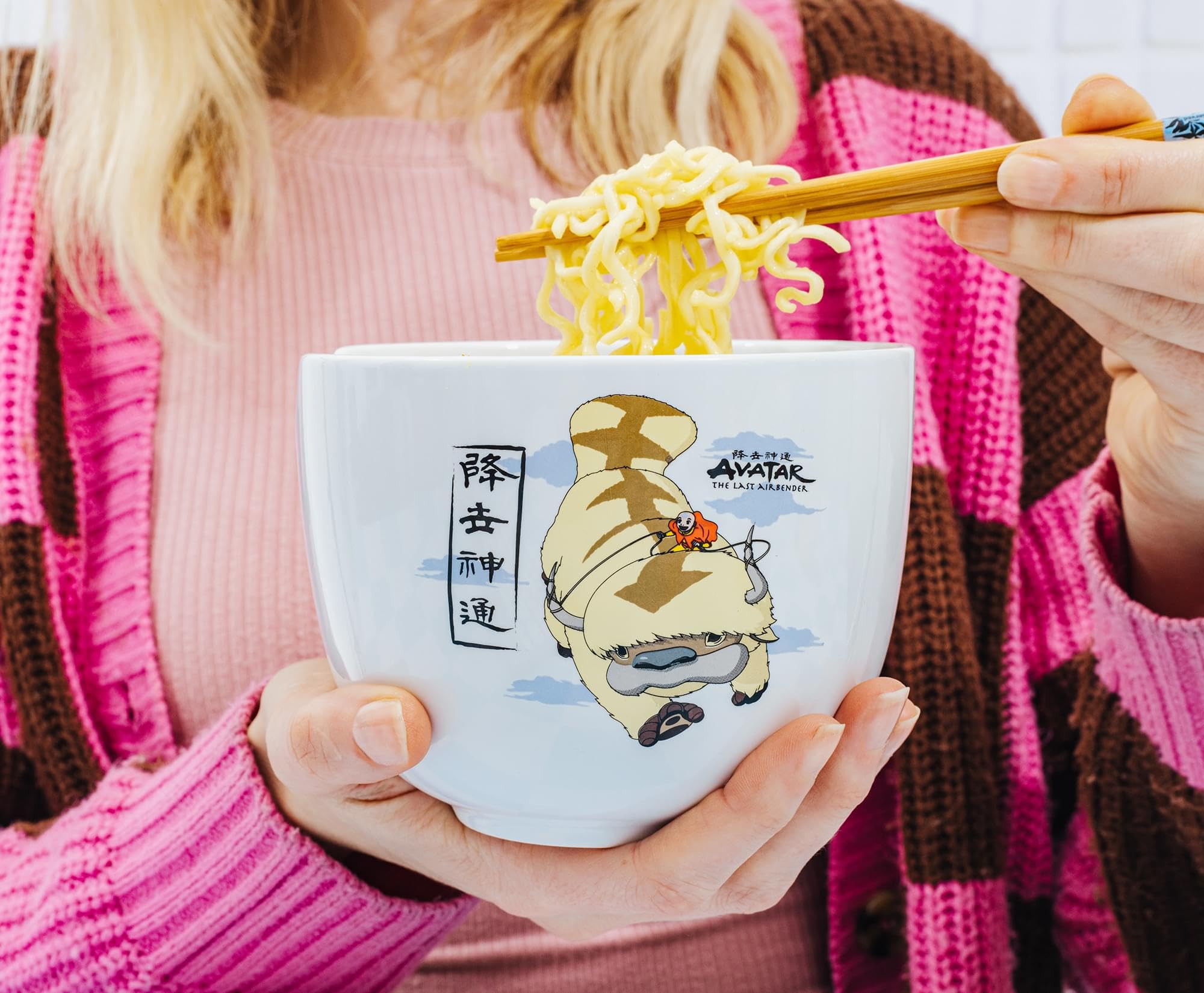 Silver Buffalo bowl held in hand to illustrate size and comfortable capture of servings