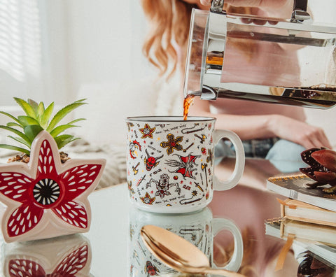 Silver Buffalo White Rabbit glass close-up featuring watch motif and charm