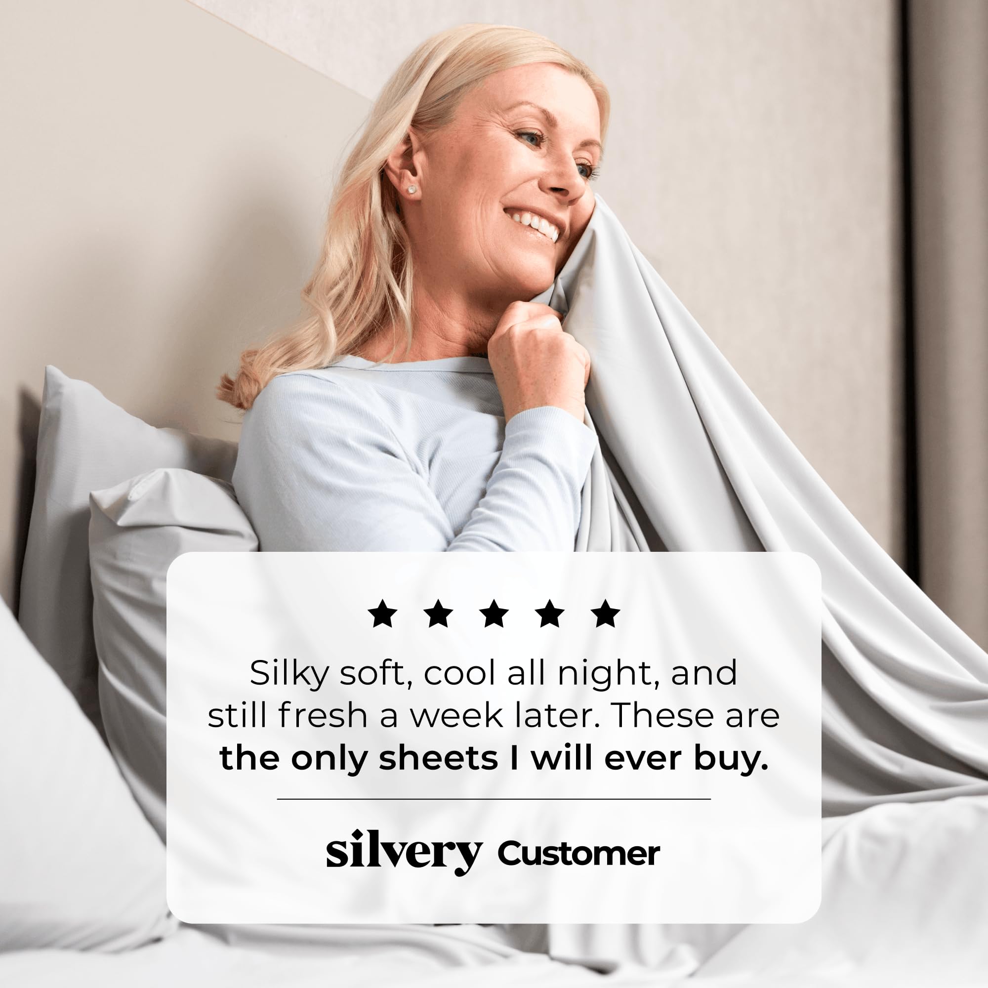 Silvery sheets next to mattress to show scale and fit