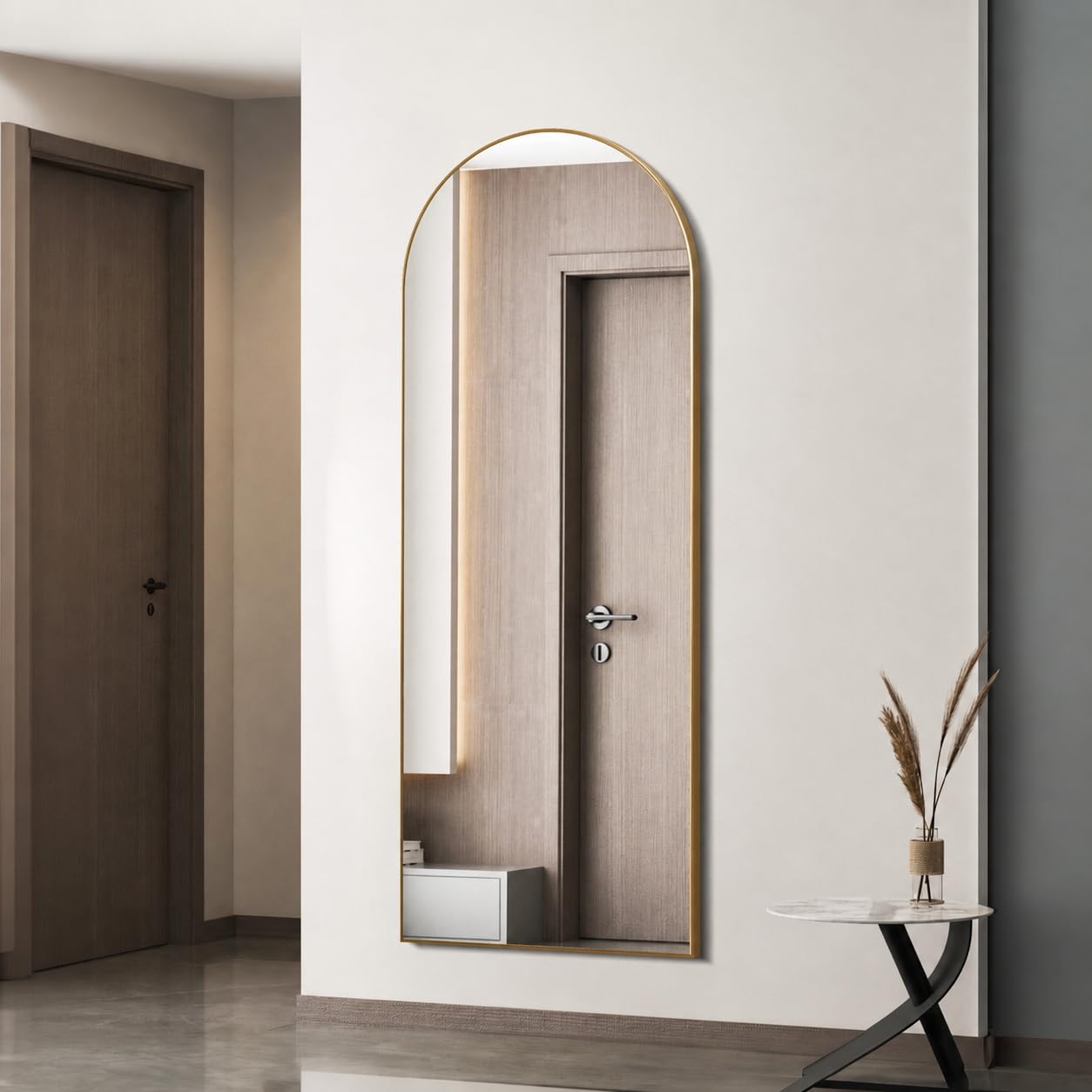 Simple Deluxe gold arched mirror front view offers full-length reflection and style