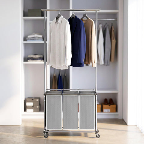 Simple Houseware laundry sorter in a bedroom holding coats and folded laundry