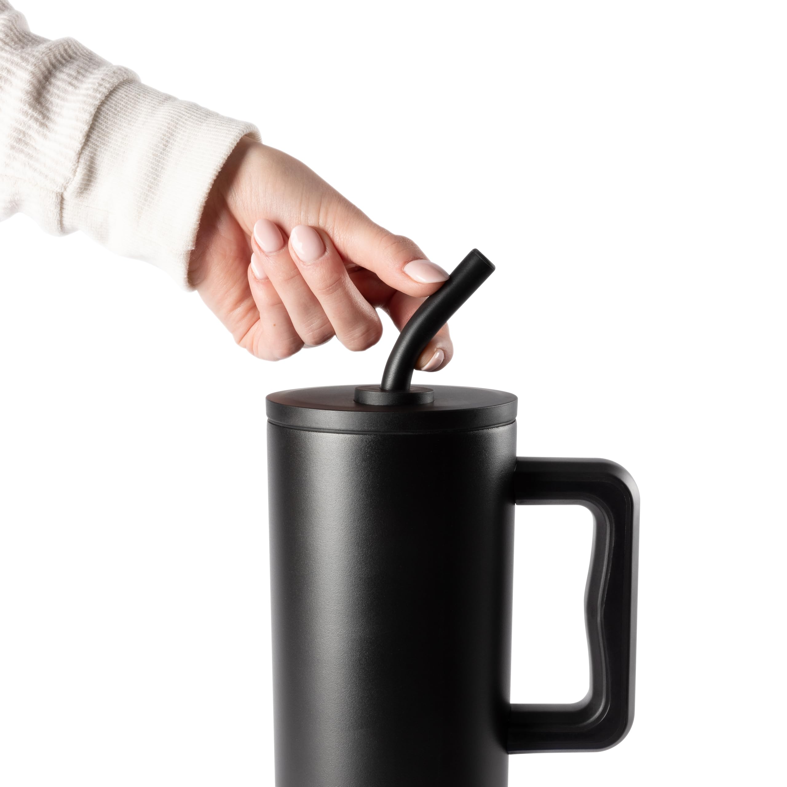 Simple Modern magenta tumbler on desk with silicone base preventing slips