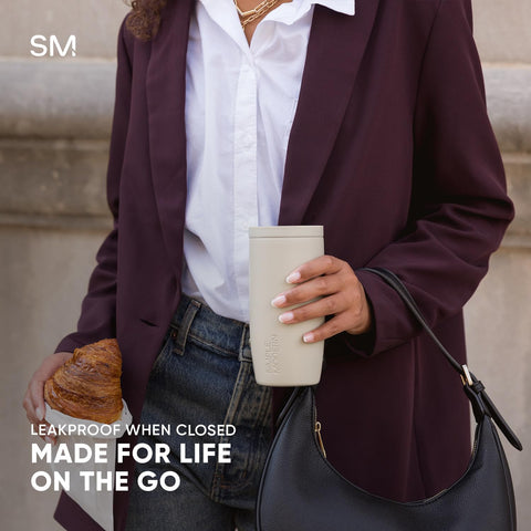 Simple Modern mug held in hand during commute for easy transport