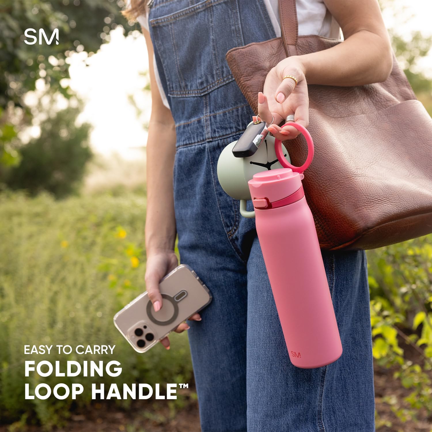 Simple Modern Mesa Loop held in hand illustrating 24oz size and easy portability