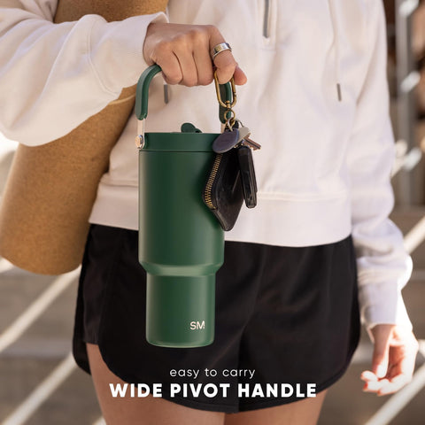 Simple Modern Trek Pivot next to water bottle for scale to show 30oz capacity