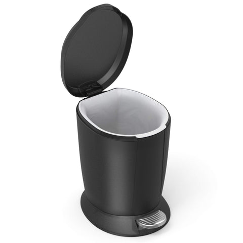 simplehuman step can in bathroom lifestyle shot highlights space-saving convenience and tidy look