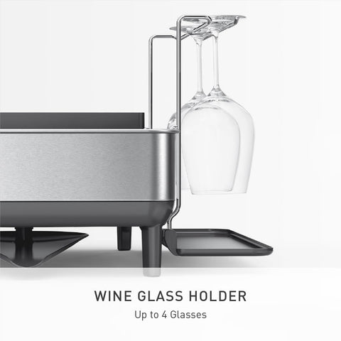simplehuman wine glass holder in use securing stems and saving plate space benefit