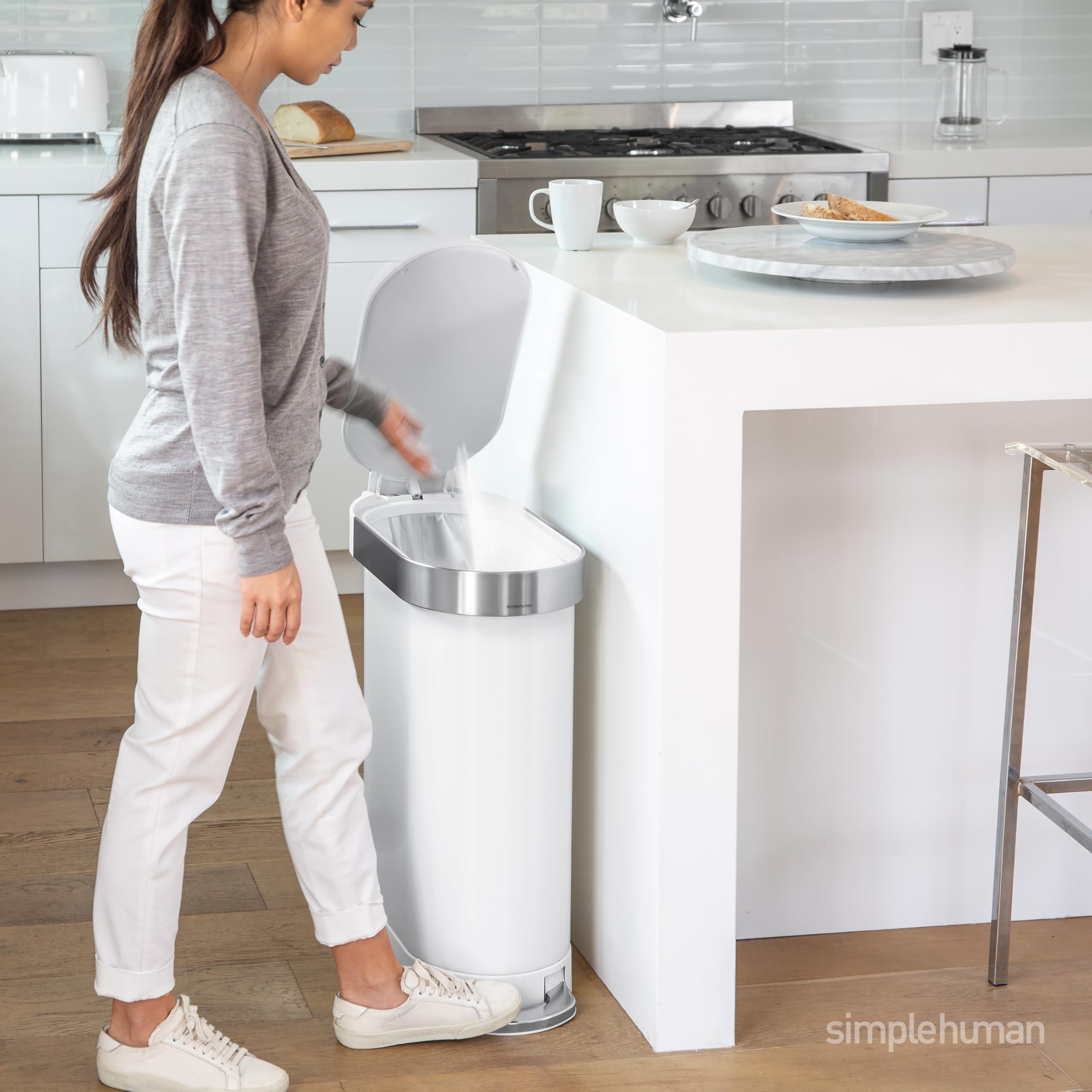 simplehuman liner rim action showing easy bag change and neat concealment