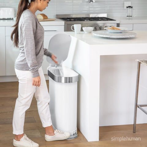 simplehuman liner rim action showing easy bag change and neat concealment