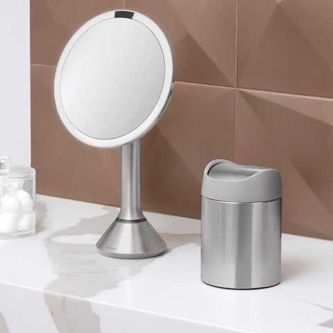 simplehuman placed on bathroom vanity with accessories, elevates decor benefit