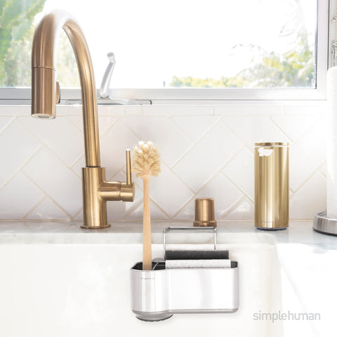 simplehuman caddy hooked inside sink, keeping sponges accessible and tidy
