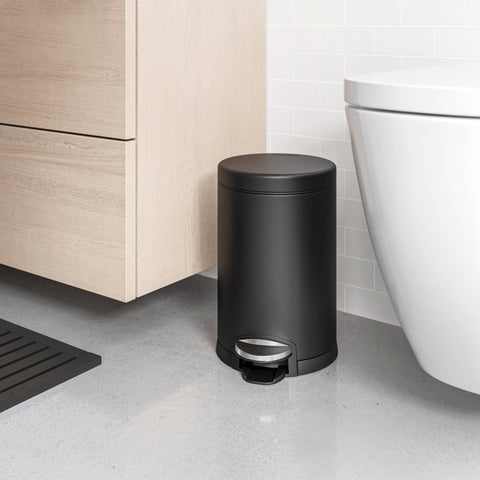 simplehuman next to toilet showing scale and space-saving benefit