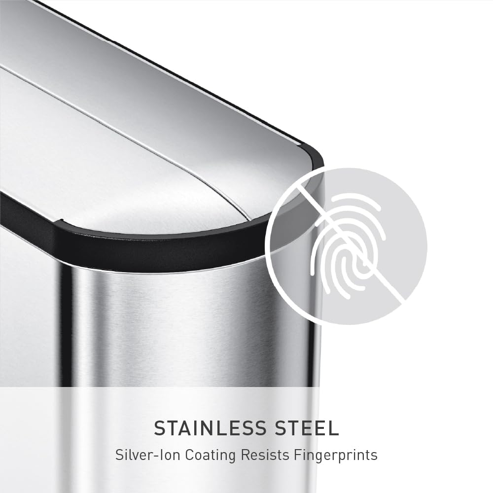 simplehuman trash can beside cabinet showing slim footprint for small spaces