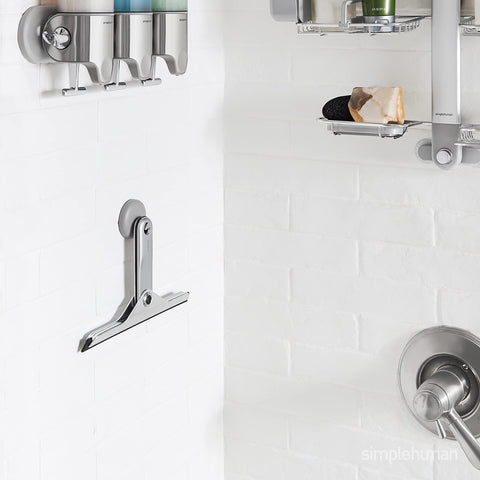 simplehuman suction hanger on tile holding squeegee for convenient access
