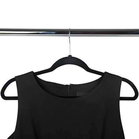 Simplify multiple hangers neatly lined on a closet rod demonstrating space-saving organization