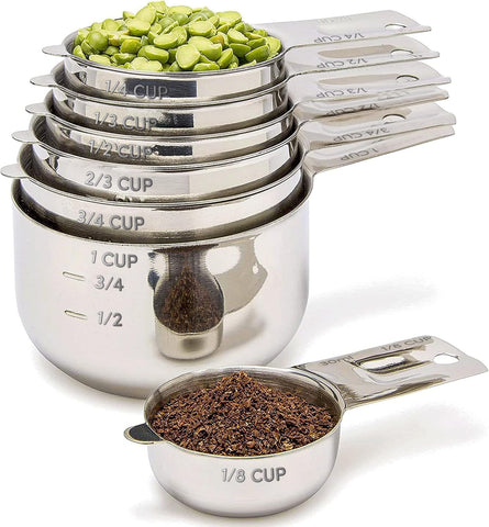 Simply Gourmet front view of the full 7-piece measuring cup set showing neat stackability and durability
