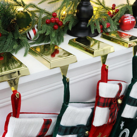 SINTENILL lifestyle scene with holiday decor showing gold holders blending with garland and candles