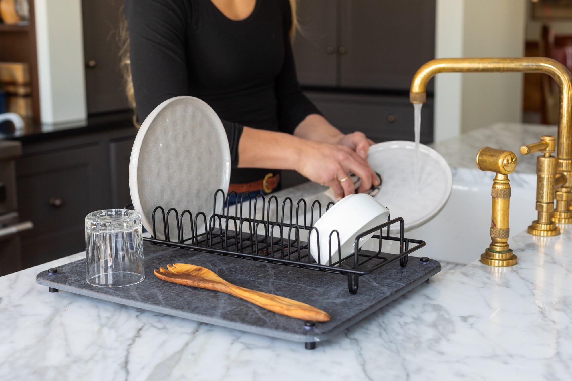 Siren Stone holding a plant saucer and pet bowl to prevent spills on counters