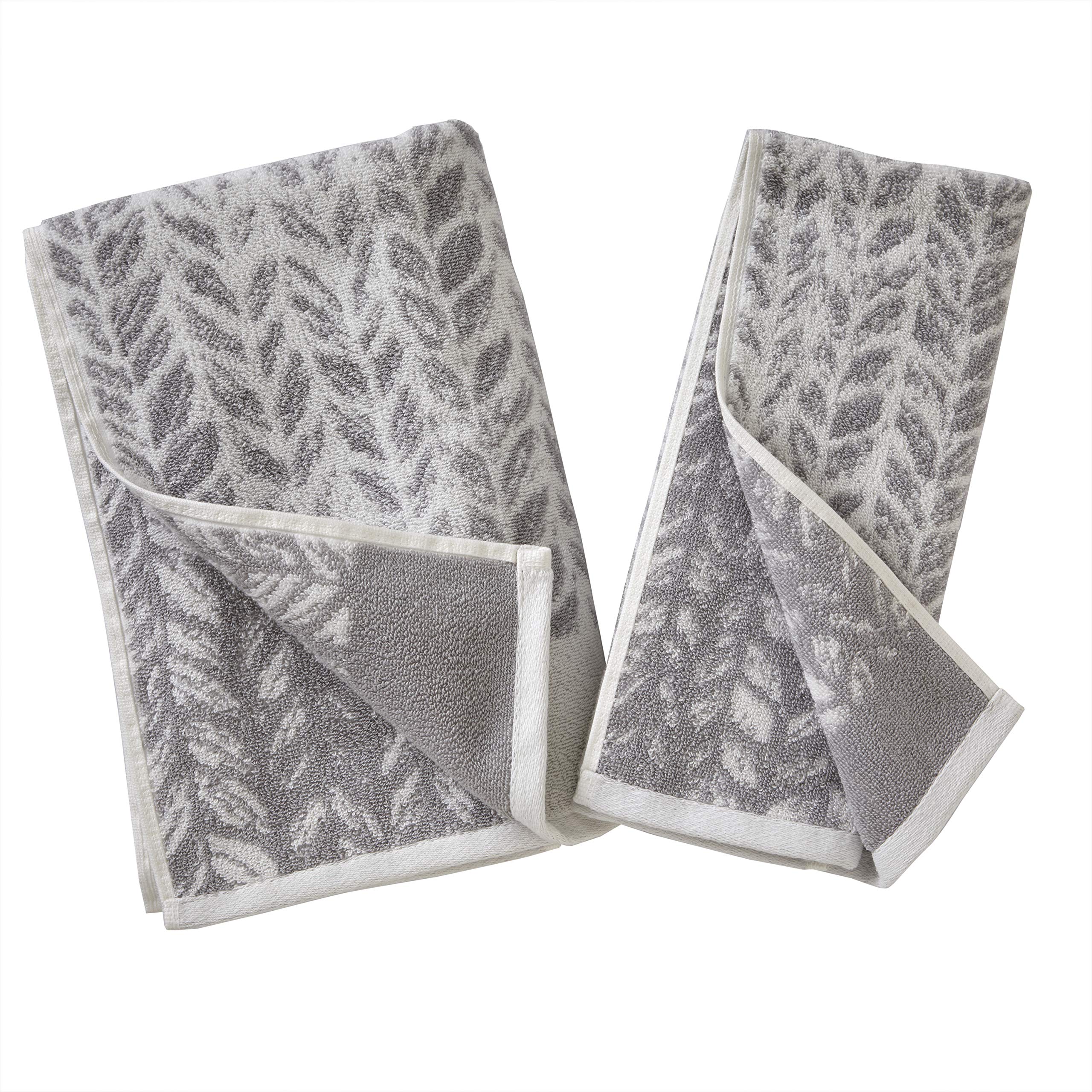 SKL Home neatly folded towels on shelf conveying tidy storage and coordinated style