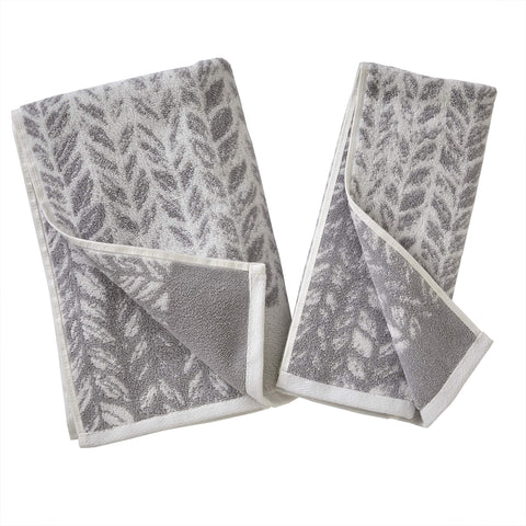 SKL Home neatly folded towels on shelf conveying tidy storage and coordinated style