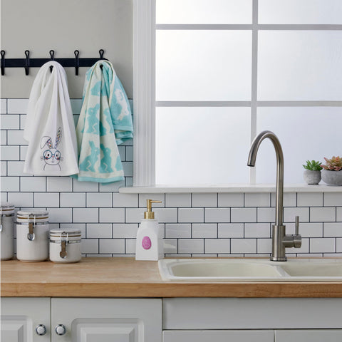 SKL Home styled in bathroom showing seasonal accent for sinks