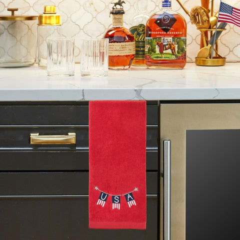 SKL HOME towel draped at bathroom sink offering decorative flair and quick access benefit