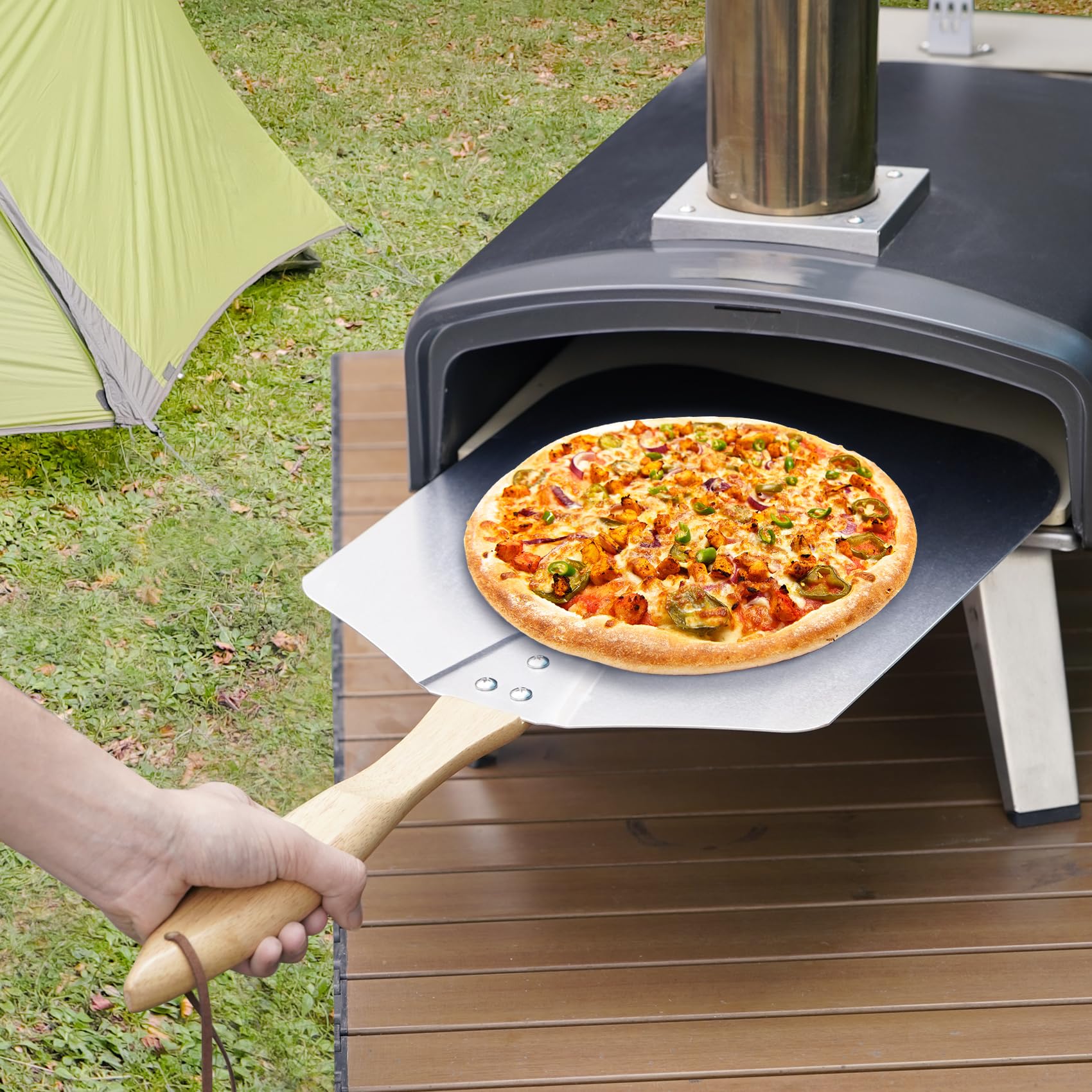 Skyflame peel beside pizza to show scale and usable surface area